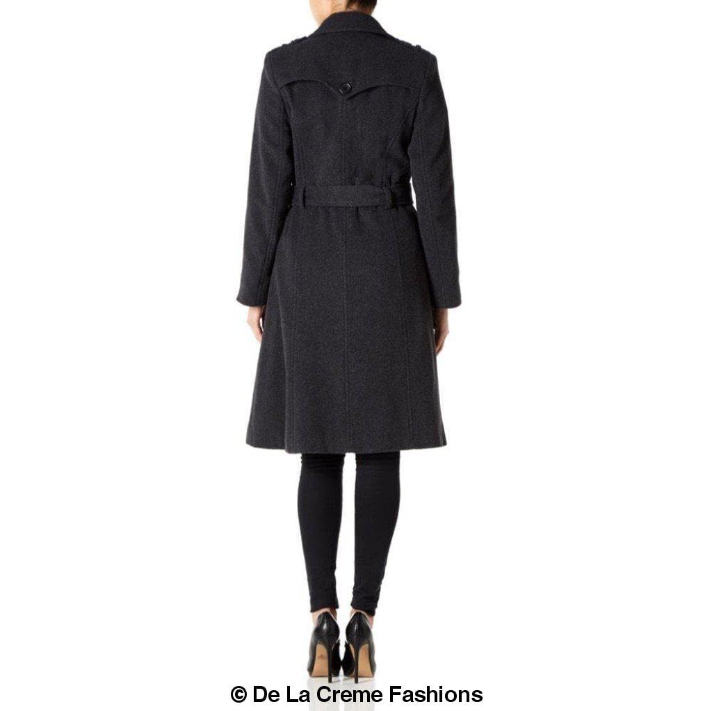 A stylish women's military coat made from a luxurious wool and cashmere blend, featuring double-breasted fastening, military epaulettes, and knee-length design.