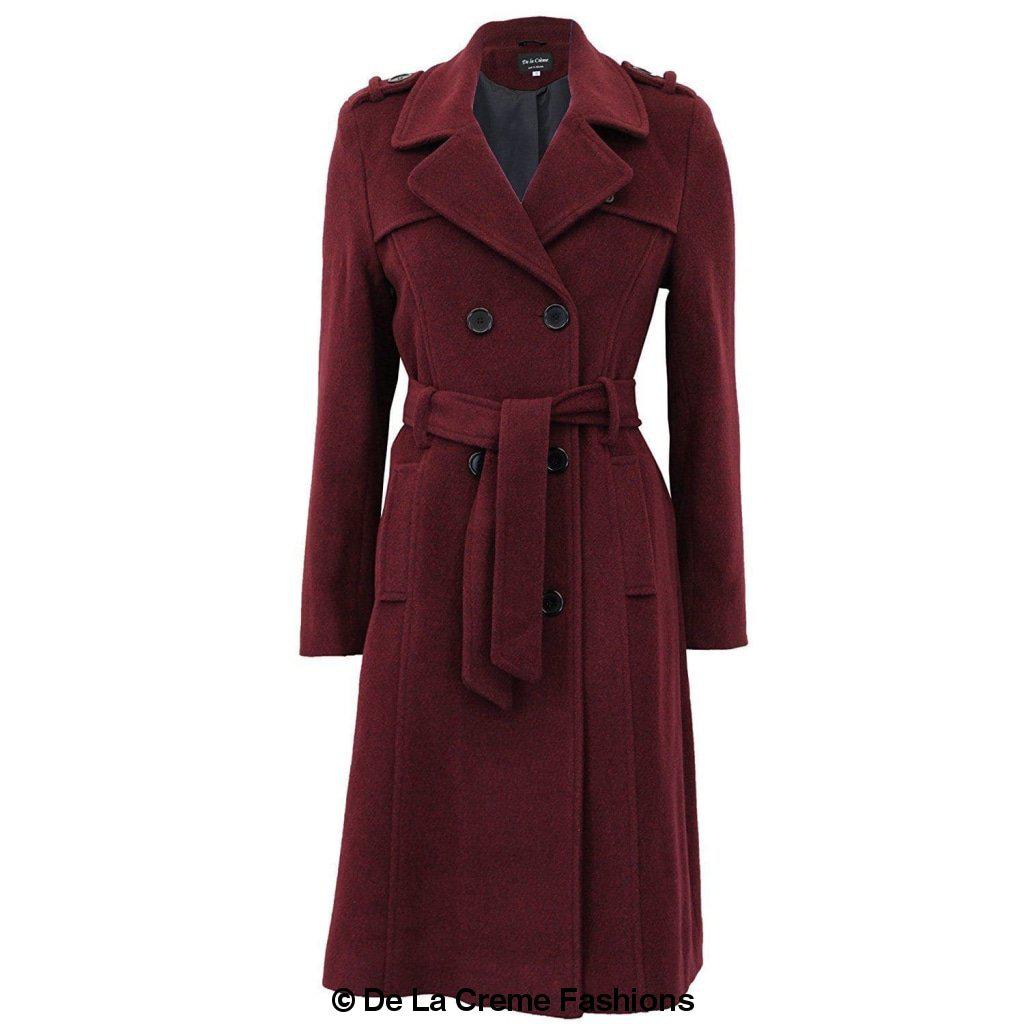 A stylish women's military coat made from a luxurious wool and cashmere blend, featuring double-breasted fastening, military epaulettes, and knee-length design.