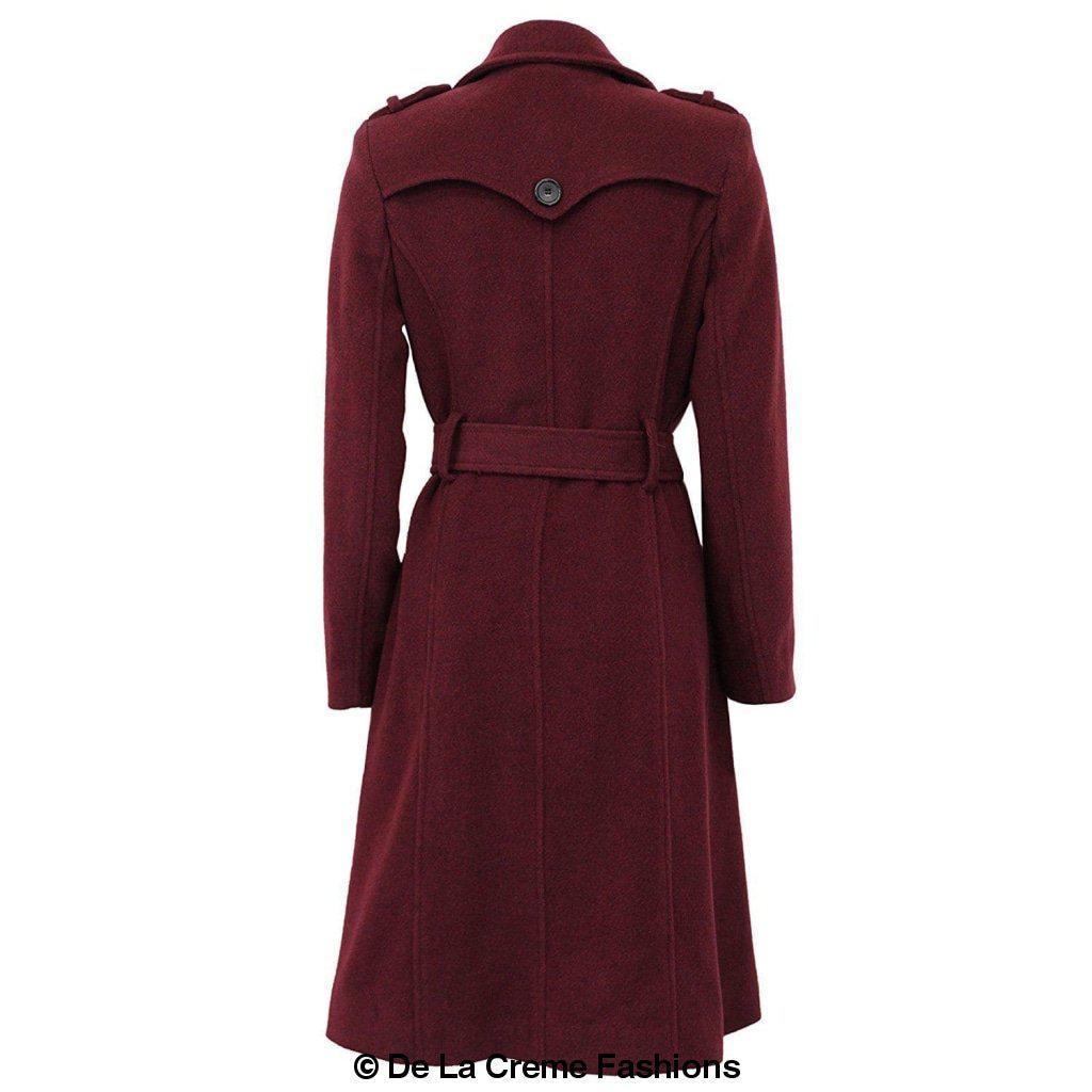 A stylish women's military coat made from a luxurious wool and cashmere blend, featuring double-breasted fastening, military epaulettes, and knee-length design.