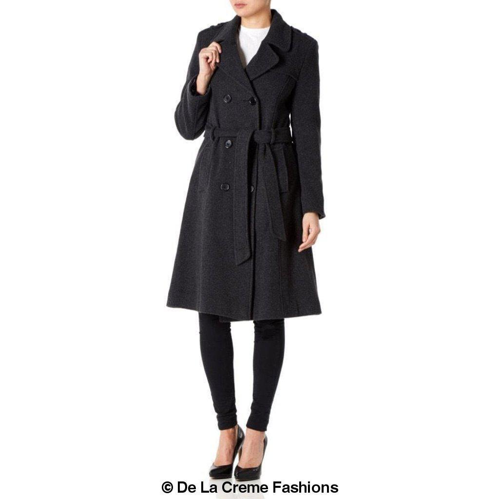 A stylish women's military coat made from a luxurious wool and cashmere blend, featuring double-breasted fastening, military epaulettes, and knee-length design.