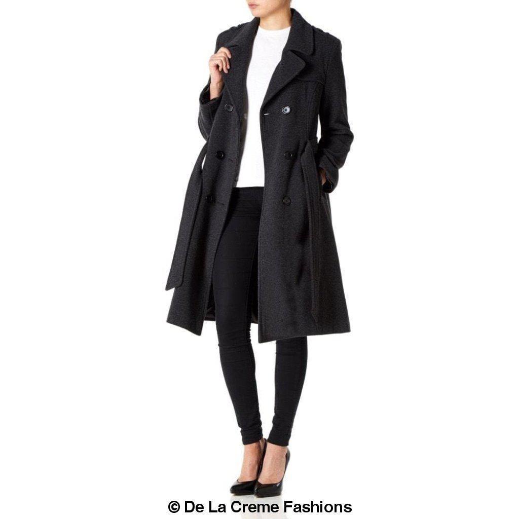 A stylish women's military coat made from a luxurious wool and cashmere blend, featuring double-breasted fastening, military epaulettes, and knee-length design.