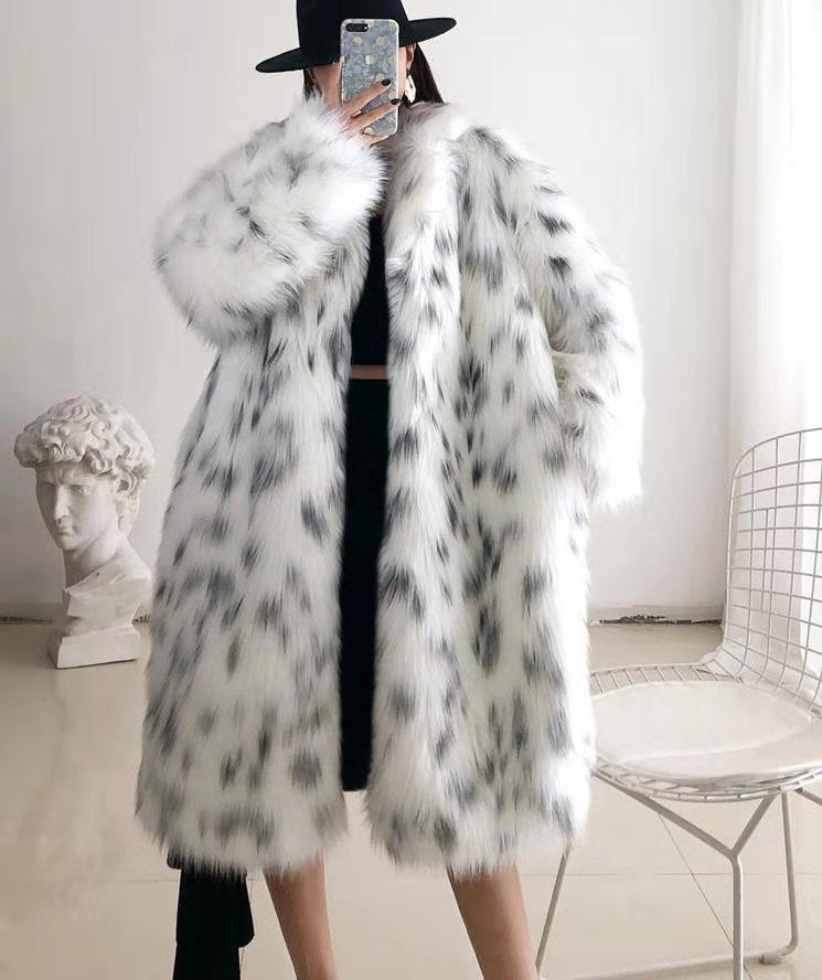 Women wearing a stylish snow leopard print faux fox fur coat, showcasing its luxurious texture and elegant design.