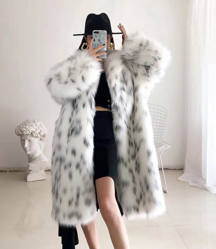 Women wearing a stylish snow leopard print faux fox fur coat, showcasing its luxurious texture and elegant design.