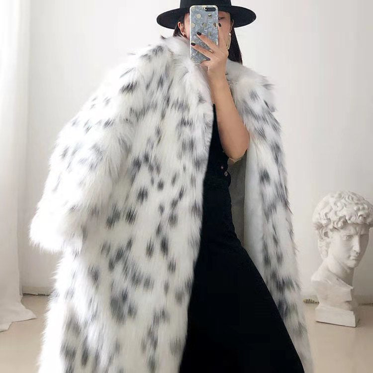 Women wearing a stylish snow leopard print faux fox fur coat, showcasing its luxurious texture and elegant design.