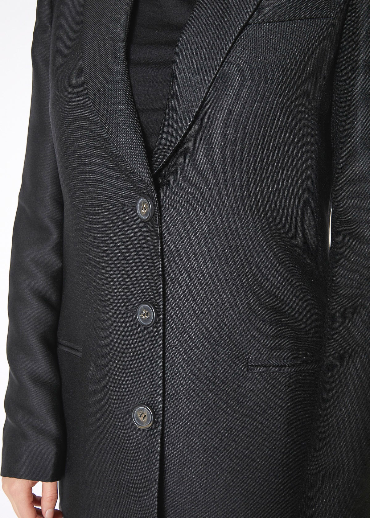 Women's black longline blazer with single-breasted button front, showcasing a stylish and edgy design.