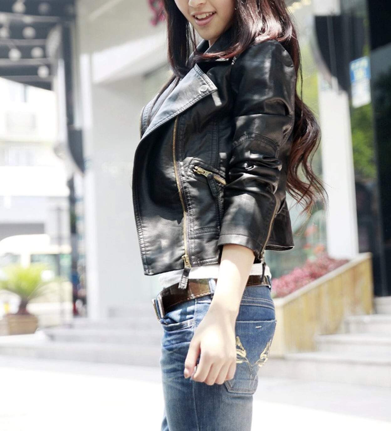 Womens Cropped Vegan Leather Jacket in black, showcasing its stylish cropped design and slim fit.