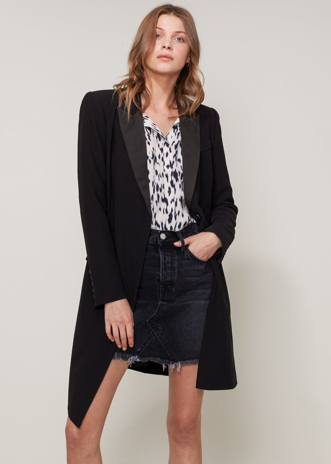 Women's double breasted long blazer in black, showcasing its stylish design and professional appeal.