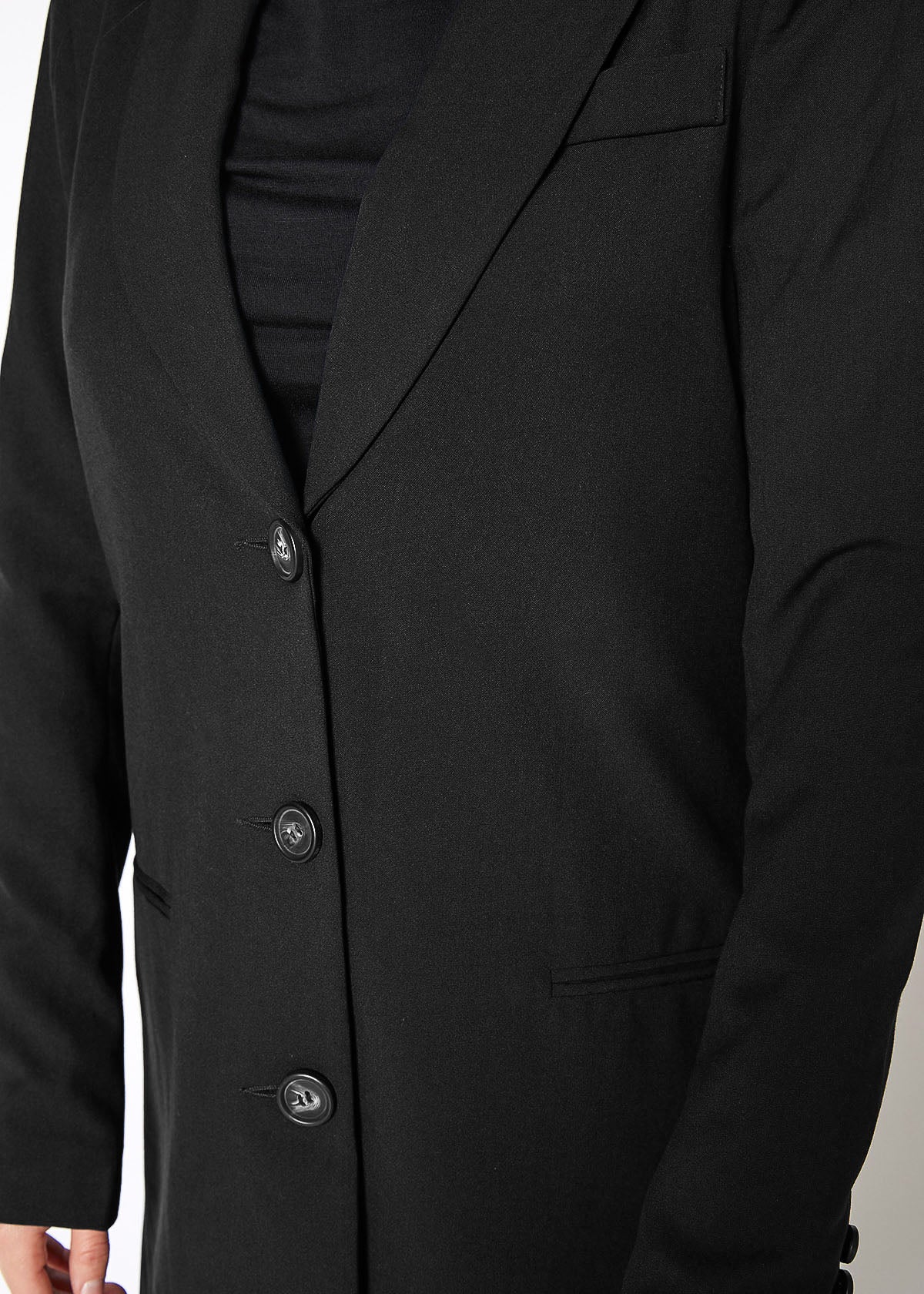 Women's Notch Lapel Longline Button Front Jacket featuring a stylish notch lapel, faux pocket hems, and large button closure, perfect for professional wear.