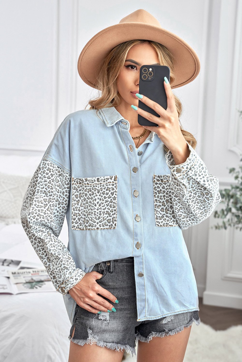 Women's Sky Blue Contrast Leopard Denim Jacket featuring leopard print sleeves and front snap closures, perfect for casual winter wear.