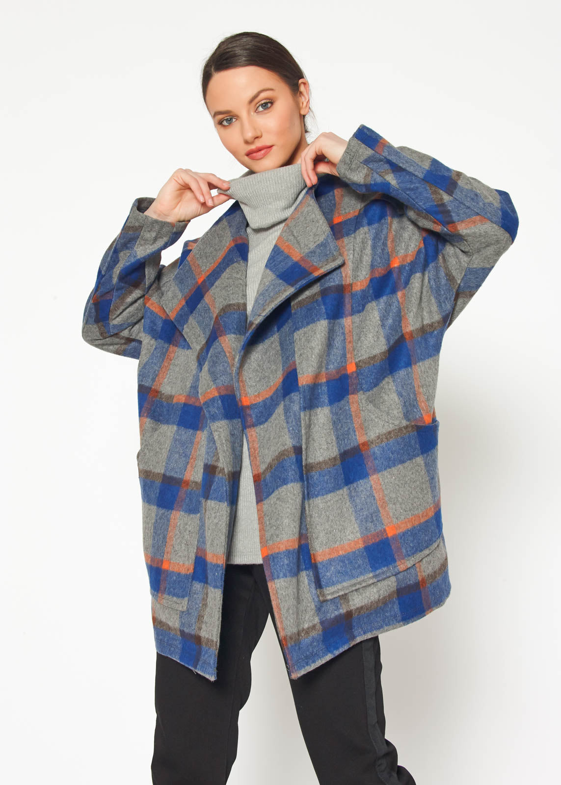 A stylish Women's Wool Blended Oversized Coat displayed on a mannequin, showcasing its cozy fabric and oversized fit.