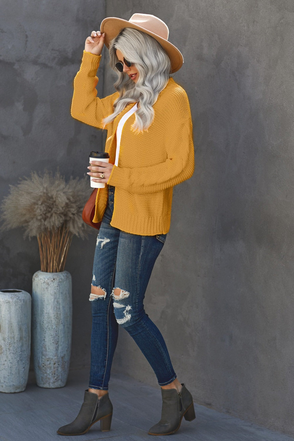 A stylish Women's Yellow Open Front Chunky Knit Cardigan featuring a slouchy fit and braided texture on sleeves, perfect for winter wear.