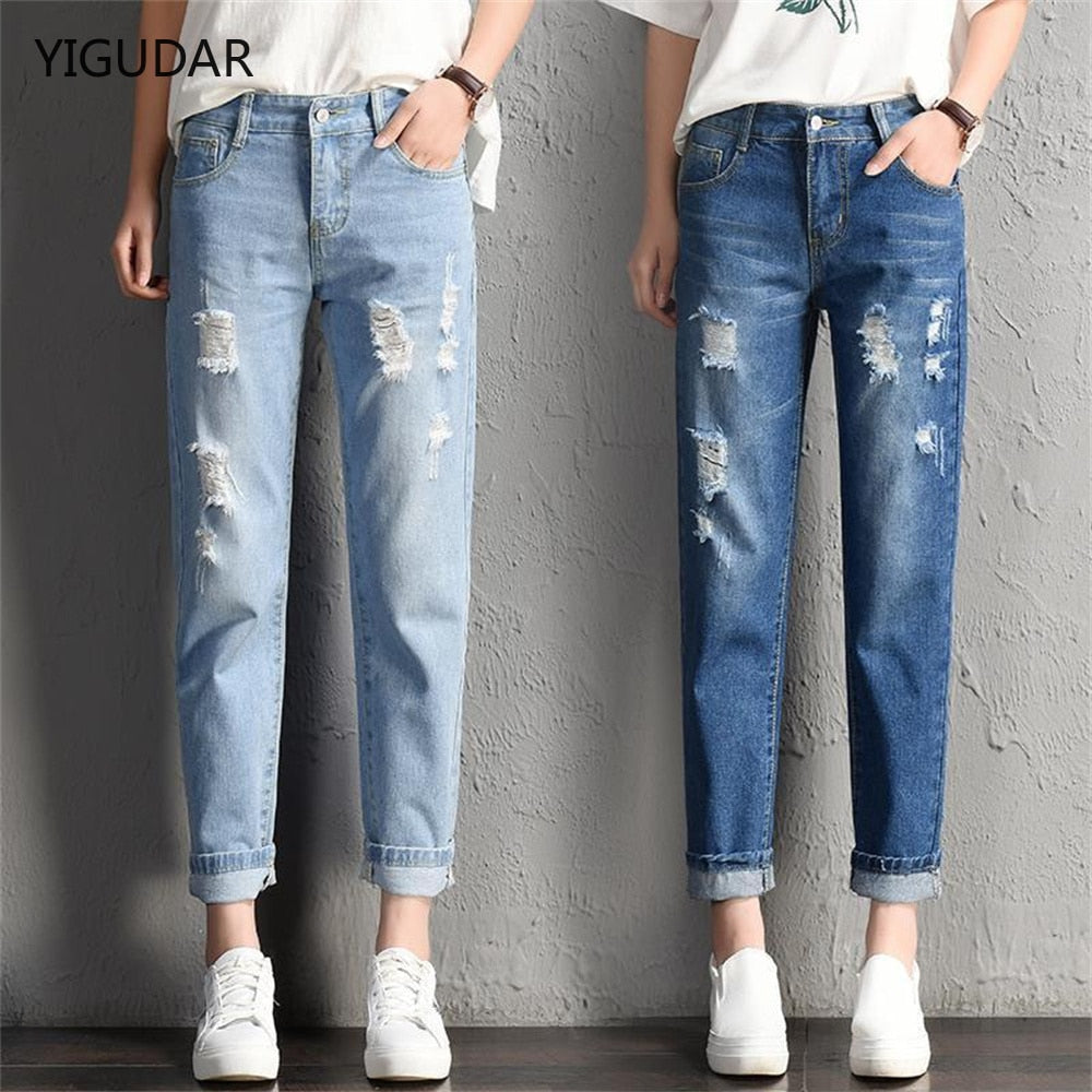 A pair of stylish mid-waist boyfriend jeans featuring big ripped holes, made from a soft cotton-polyester blend, perfect for casual wear.