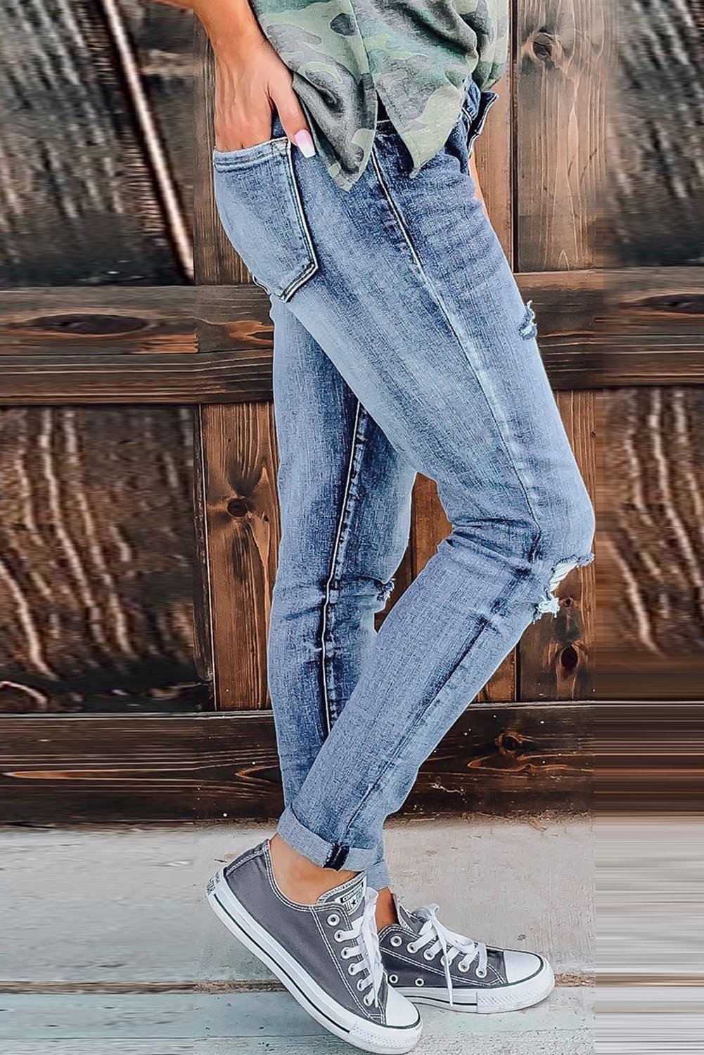 Fashion Women's Blue Hollow Out Button-fly Distressed Jeans showcasing a trendy design with button closure and distressed details.