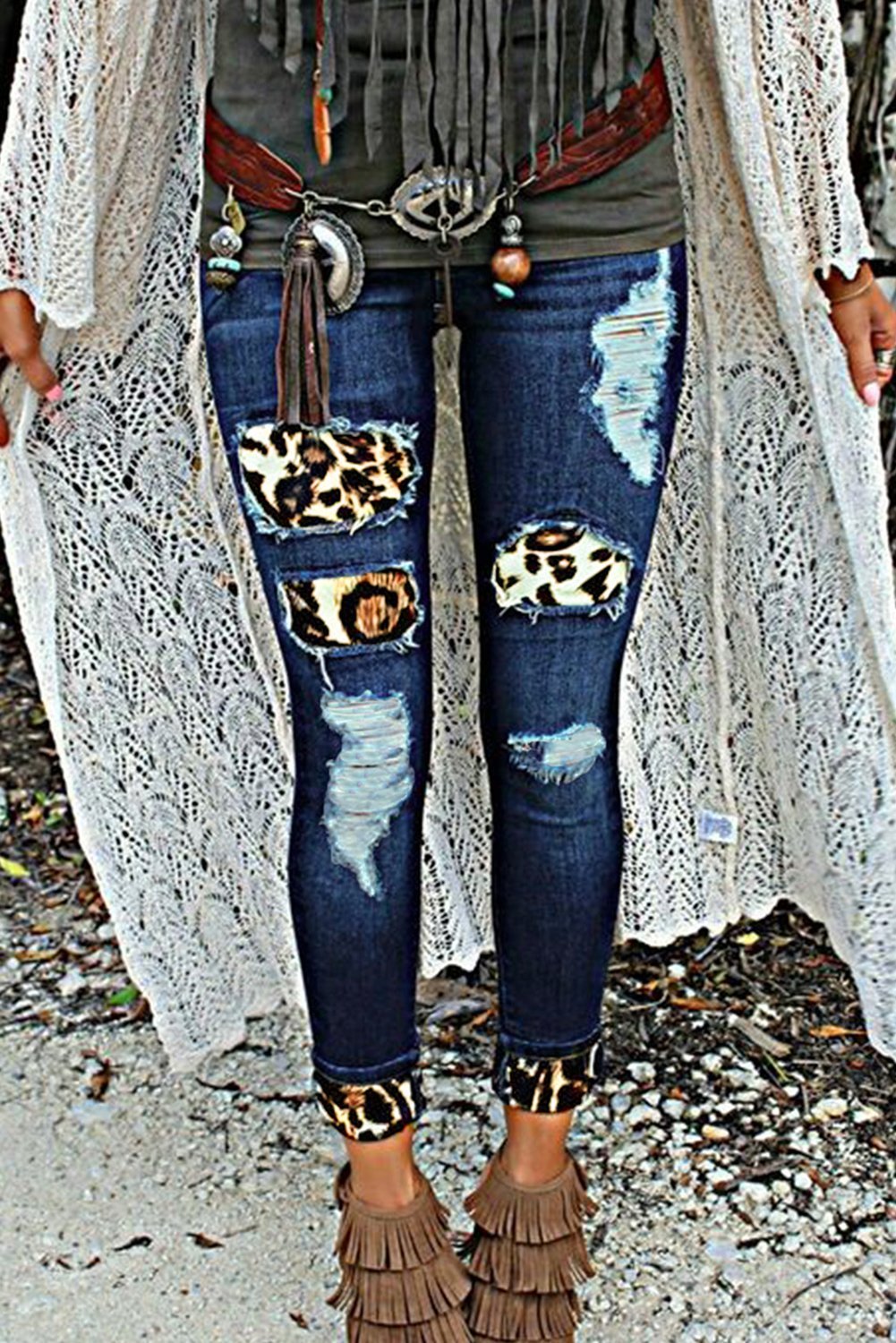 Fashion Women's Blue Hollow Out Leopard Splice Ripped Jeans showcasing a trendy design with hollow-out details and leopard splicing, perfect for casual wear.