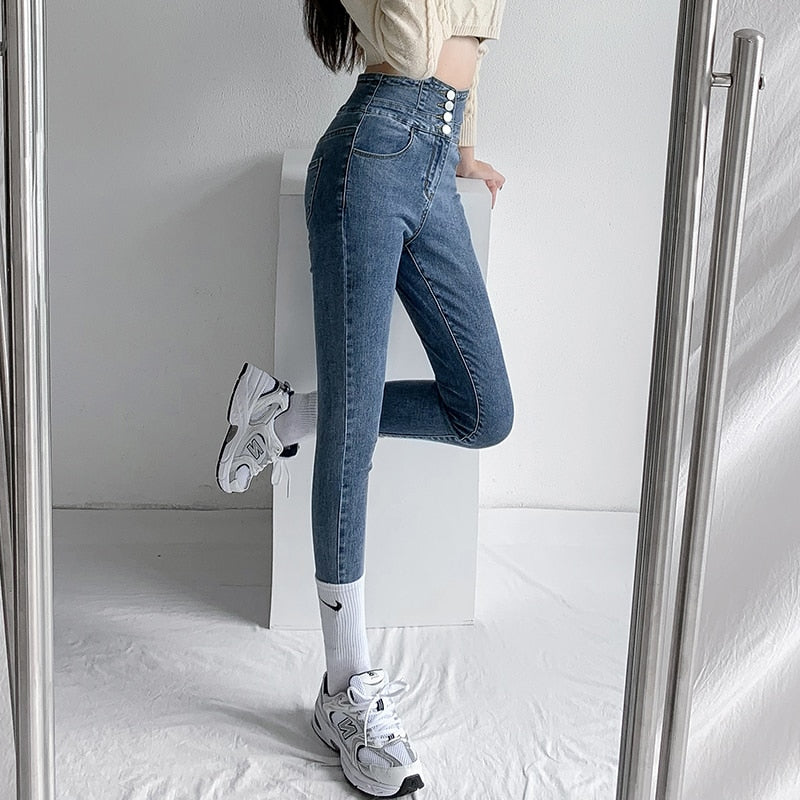 Skinny pencil jeans featuring a vintage high waist design with four buttons, made from stretchy cotton denim, perfect for a stylish look.