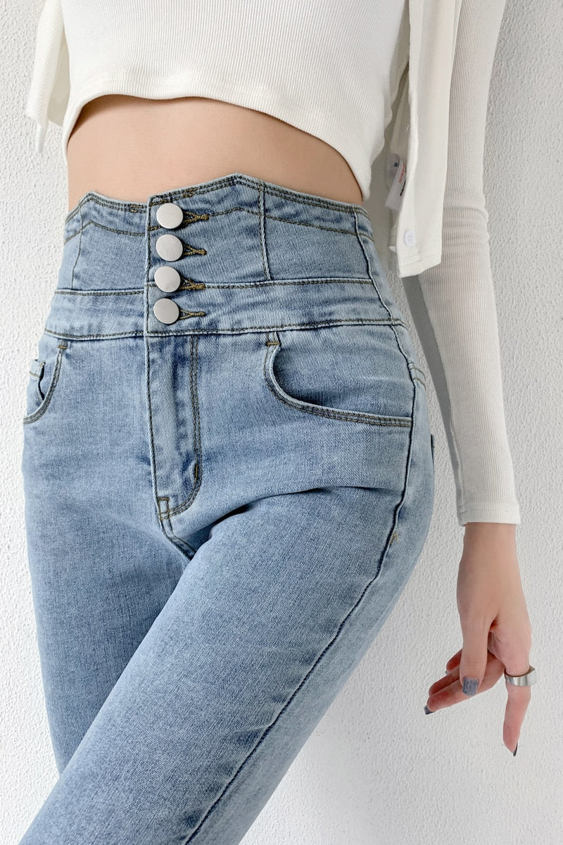 Skinny pencil jeans featuring a vintage high waist design with four buttons, made from stretchy cotton denim, perfect for a stylish look.