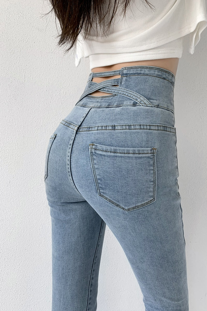 Skinny pencil jeans featuring a vintage high waist design with four buttons, made from stretchy cotton denim, perfect for a stylish look.