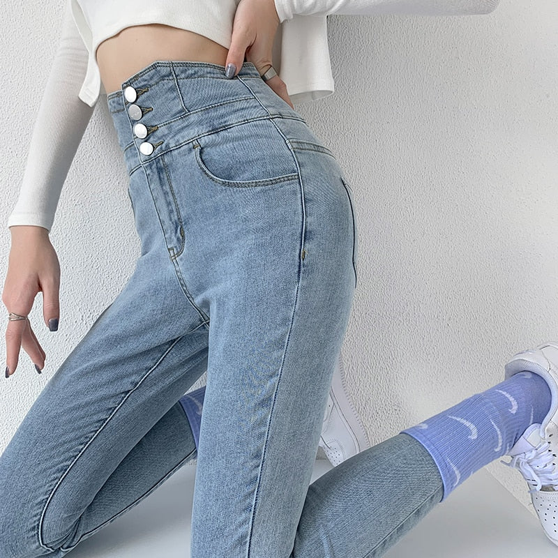 Skinny pencil jeans featuring a vintage high waist design with four buttons, made from stretchy cotton denim, perfect for a stylish look.