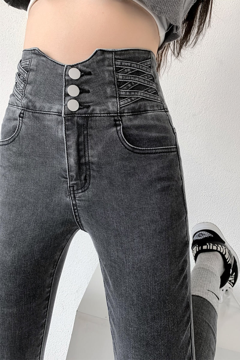 Skinny pencil jeans featuring a vintage high waist design with four buttons, made from stretchy cotton denim, perfect for a stylish look.