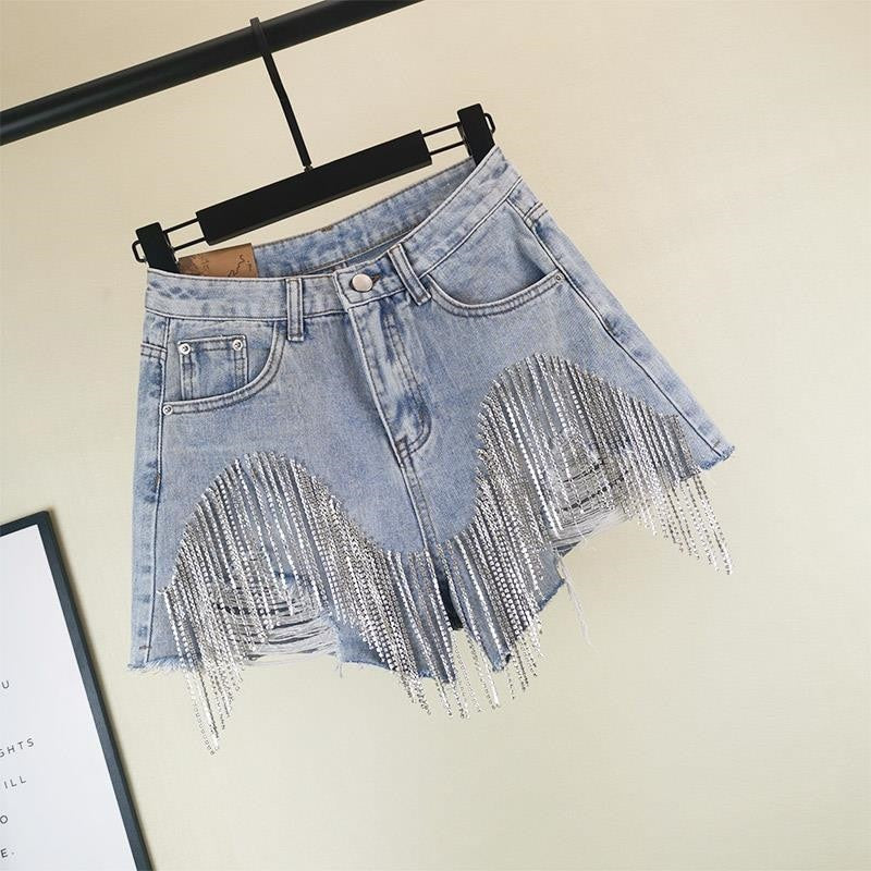 Women luxurious tassel rhinestone fringed hole jeans shorts, high waist design, showcasing stylish details and a flattering fit.