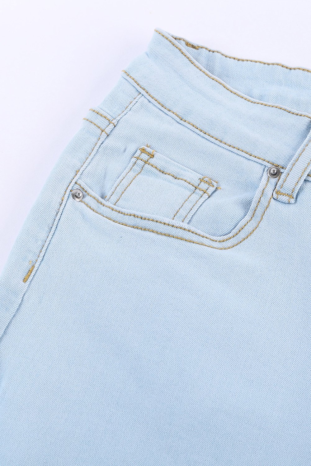 A pair of women's sky blue washed ripped knee wide-leg jeans, featuring a high-rise design and button fly closure, displayed on a white background.