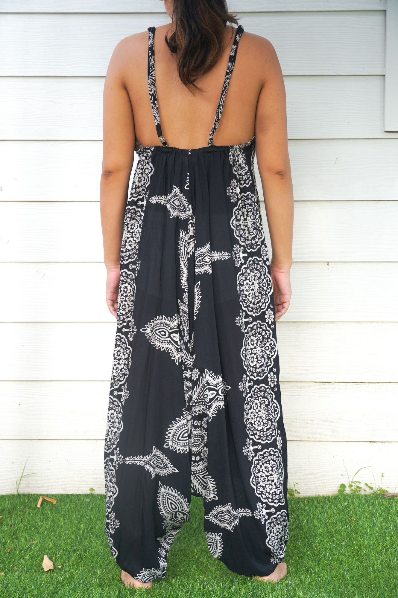 Black Butterfly Hippie Jumpsuit featuring wide legs and adjustable straps, perfect for festivals and summer wear.