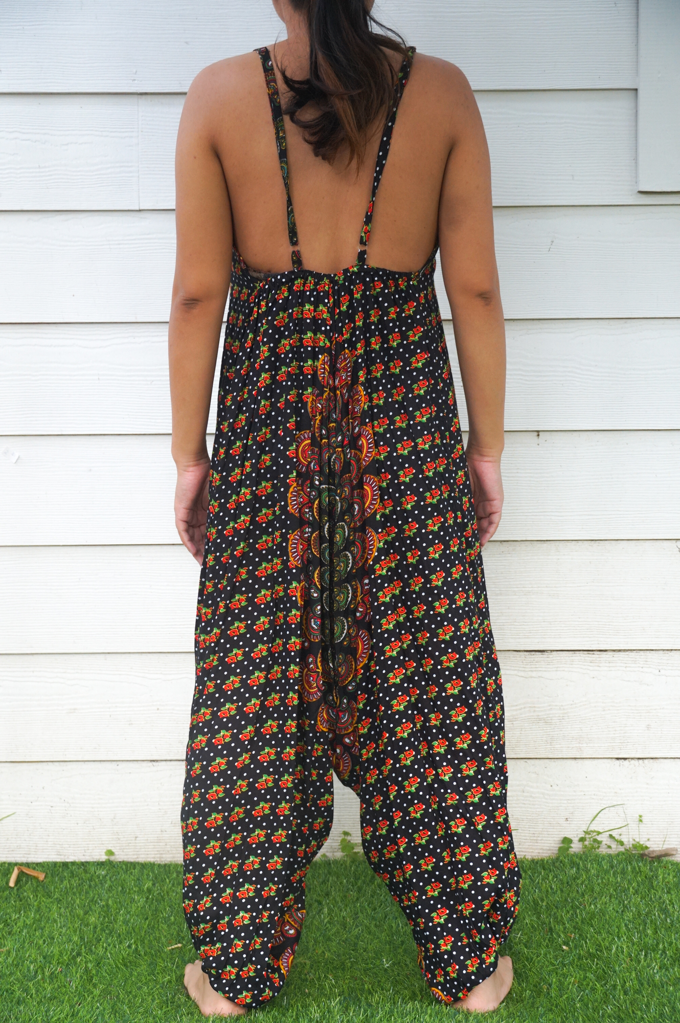 Black Chakra Hippie Jumpsuit featuring wide legs, adjustable straps, and elasticated back, perfect for festivals and summer wear.