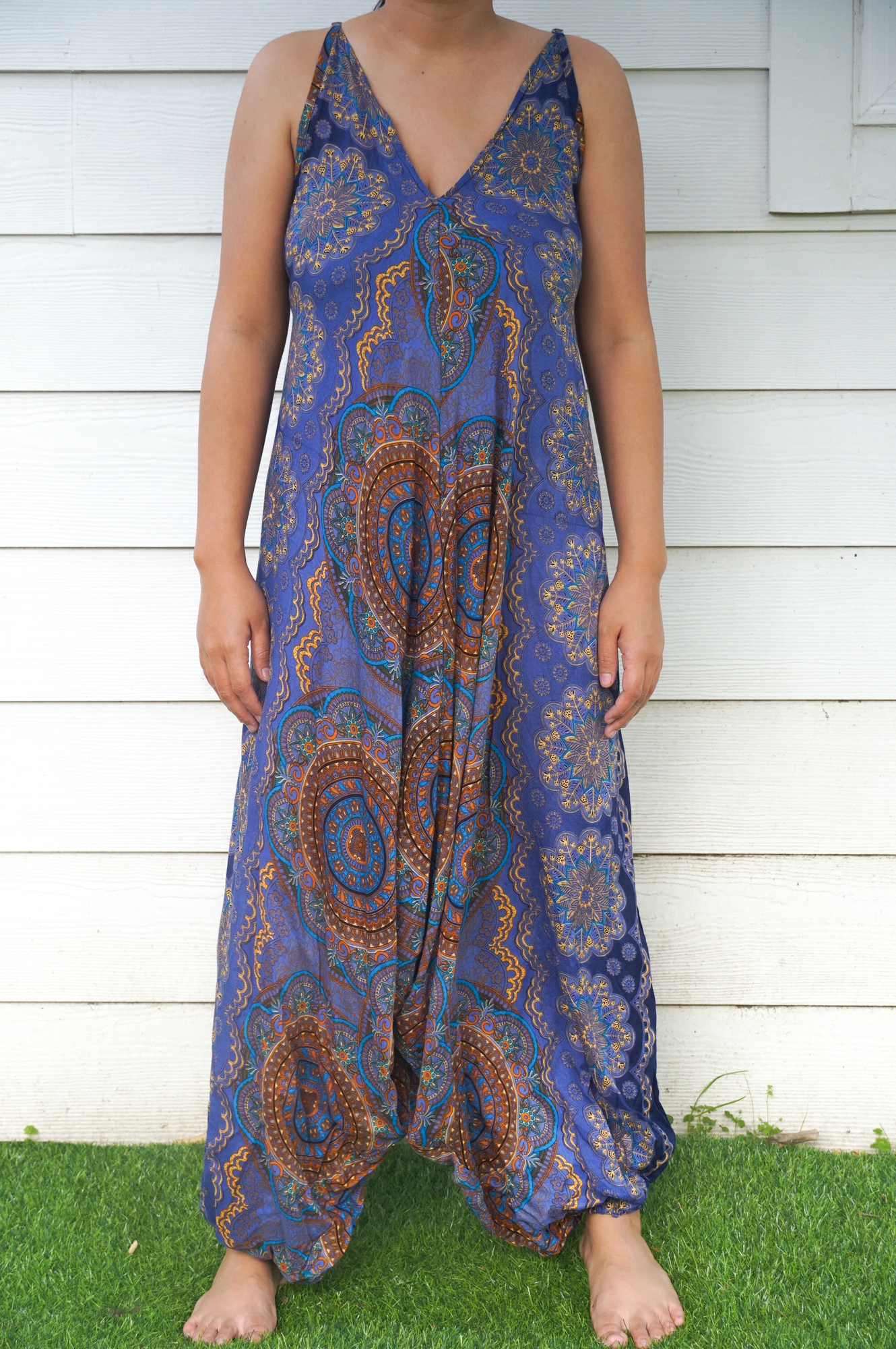 A stylish Blue Mandala Boho Hippie Jumpsuit featuring adjustable straps, wide legs, and a vibrant mandala pattern, perfect for summer festivals.