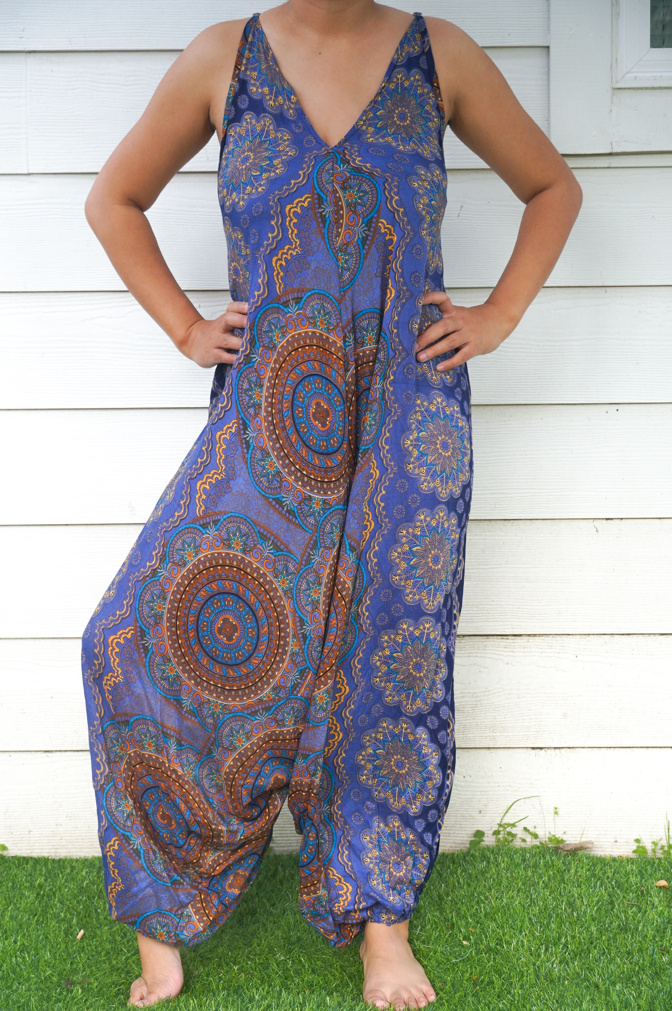 A stylish Blue Mandala Boho Hippie Jumpsuit featuring adjustable straps, wide legs, and a vibrant mandala pattern, perfect for summer festivals.