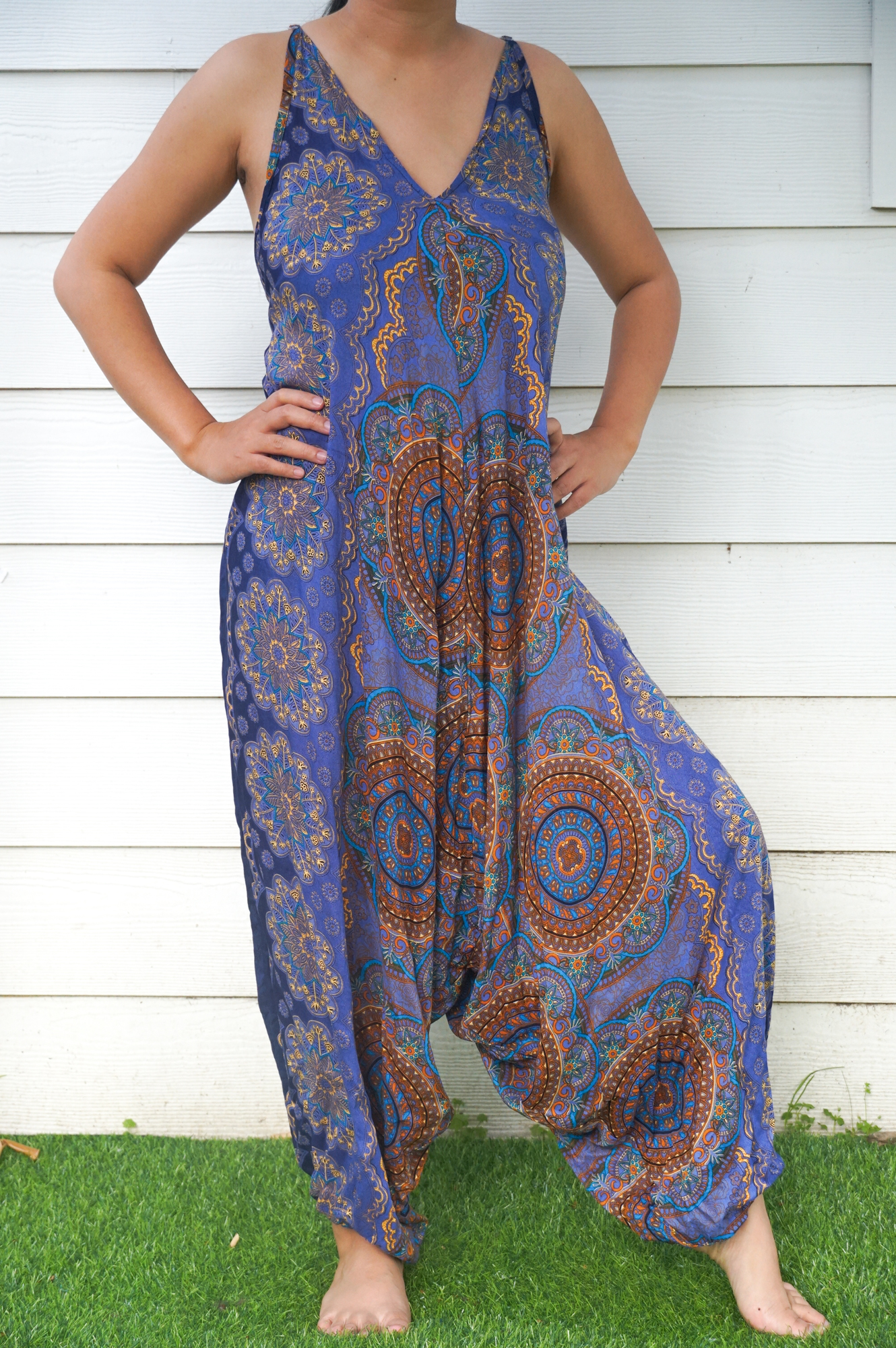 A stylish Blue Mandala Boho Hippie Jumpsuit featuring adjustable straps, wide legs, and a vibrant mandala pattern, perfect for summer festivals.