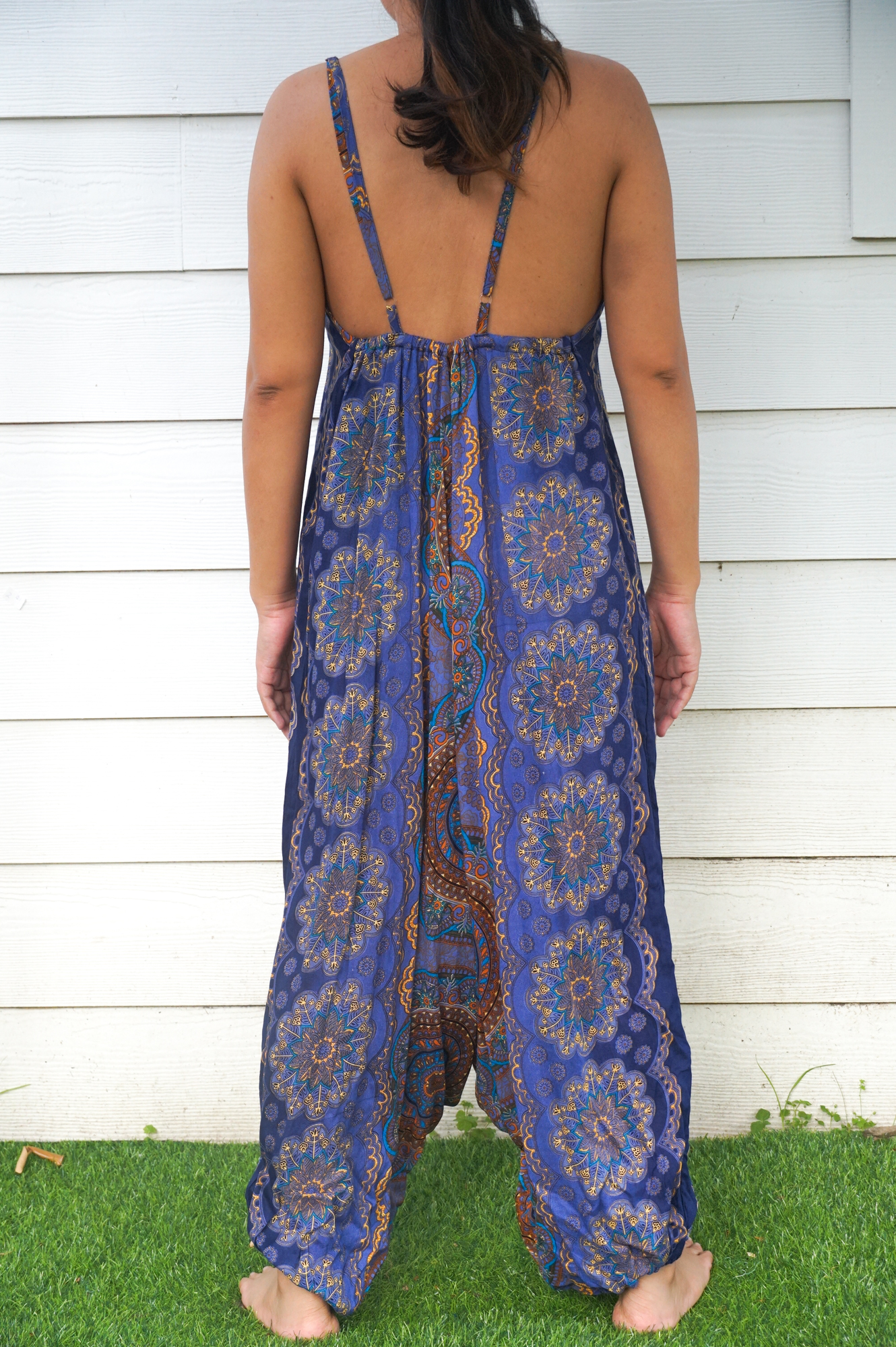 A stylish Blue Mandala Boho Hippie Jumpsuit featuring adjustable straps, wide legs, and a vibrant mandala pattern, perfect for summer festivals.