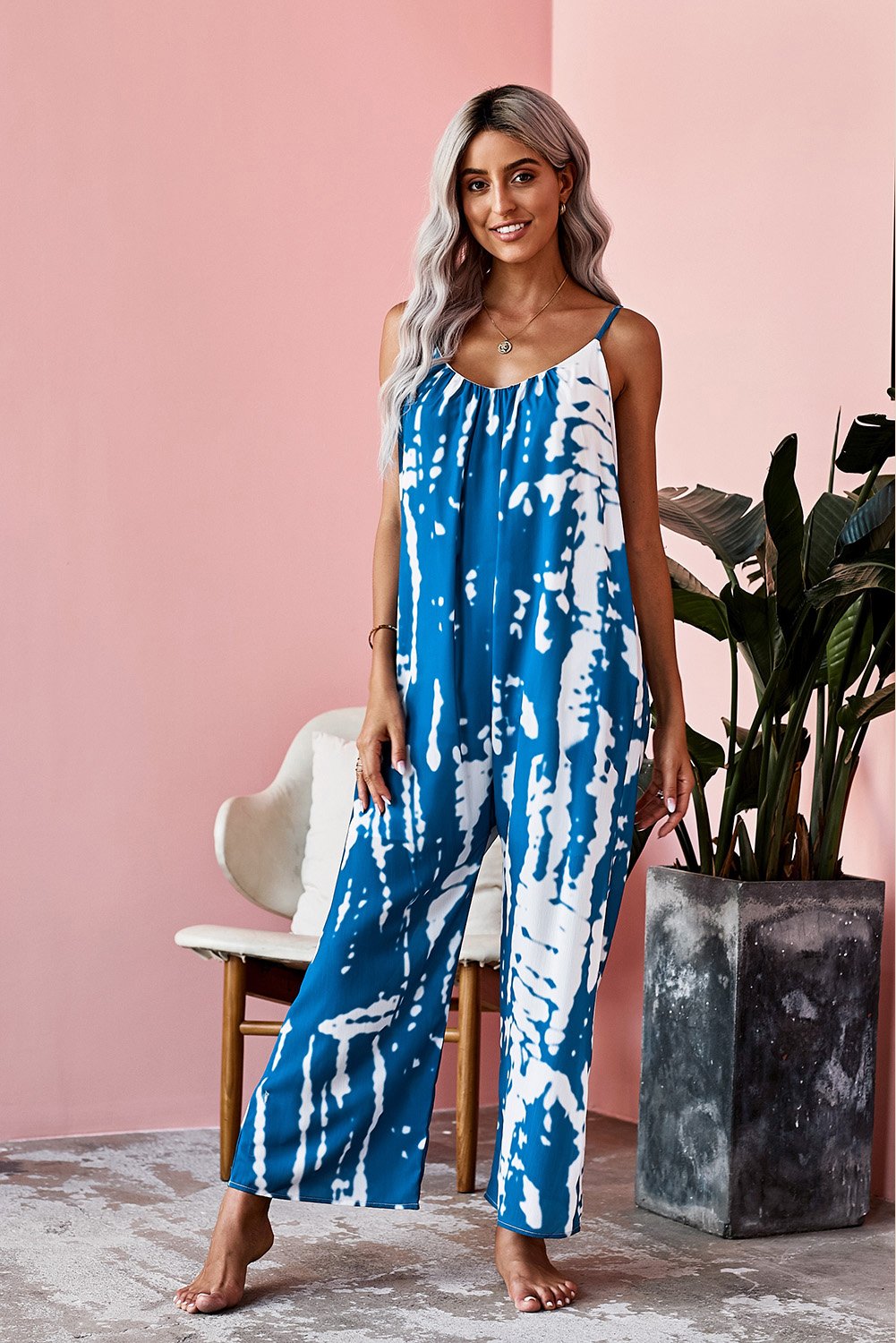 Casual blue spaghetti strap tie dye baggy long pants romper featuring a v-neck design and wide leg fit, perfect for summer wear.