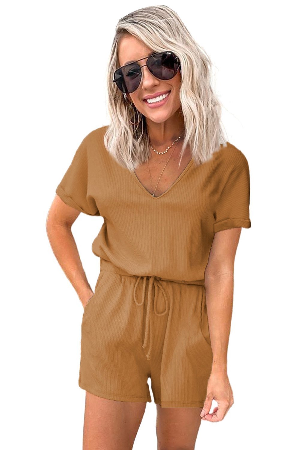 Casual brown short sleeve pocketed knit romper featuring a v-neck and elastic drawstring waist, perfect for summer wear.