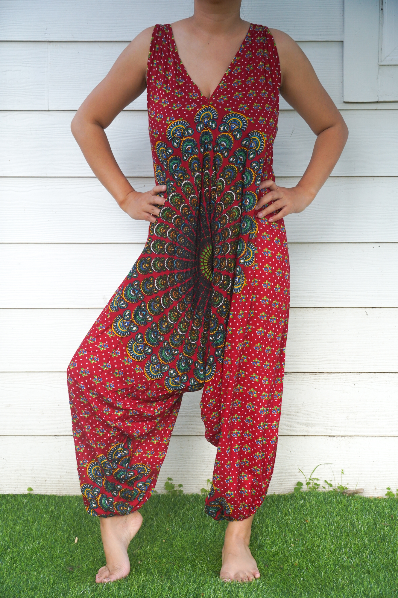 A vibrant Red Chakra Hippie Jumpsuit featuring wide legs, adjustable straps, and elasticated back, perfect for festivals and summer outings.