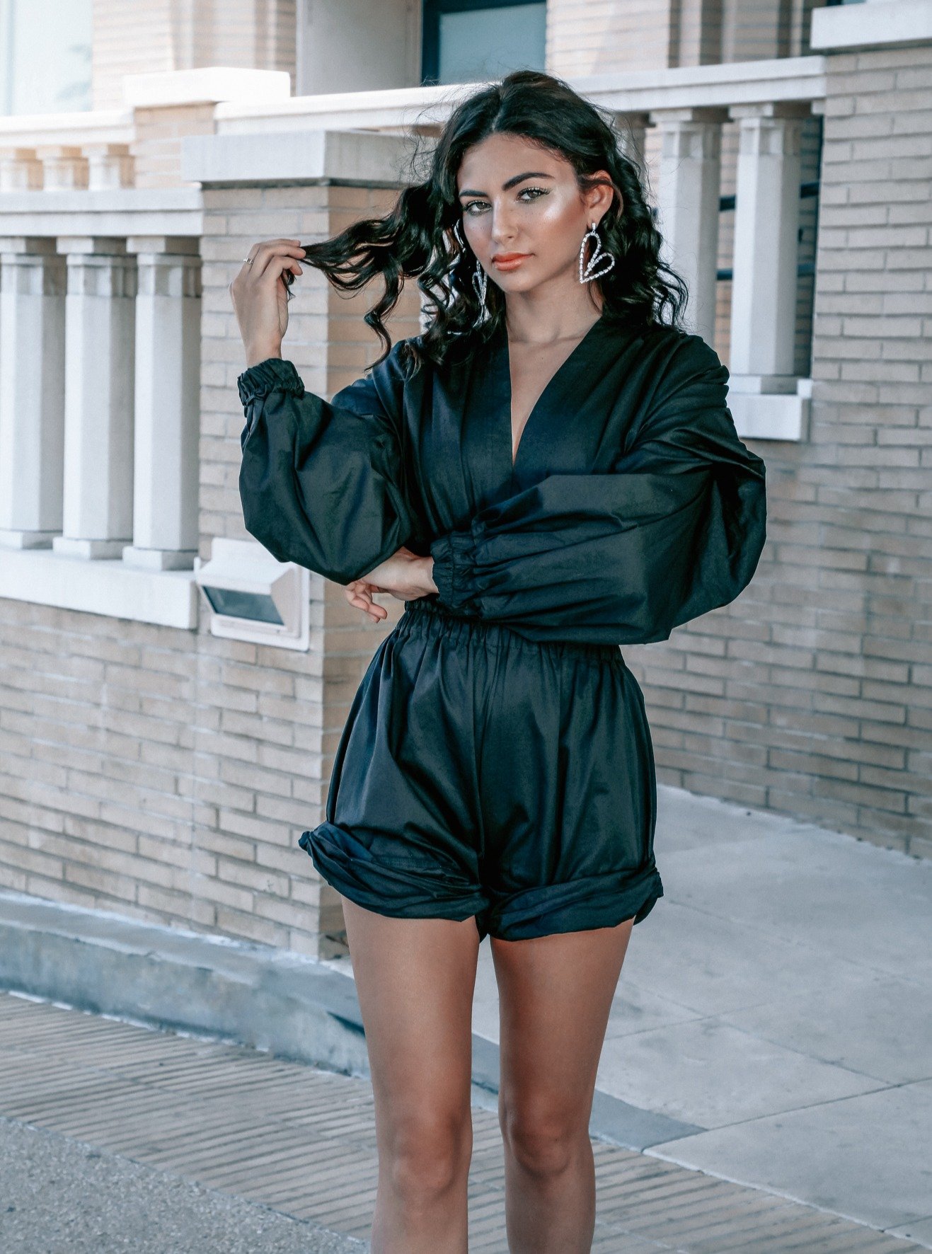 The Right Puff Romper featuring a plunging neckline, ruched waistline, and voluminous puffed sleeves in a lightweight cotton blend.