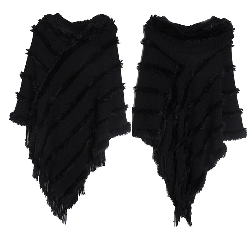 A stylish women winter knit hooded poncho cape with fringed edges, perfect for chilly weather and versatile for spring.