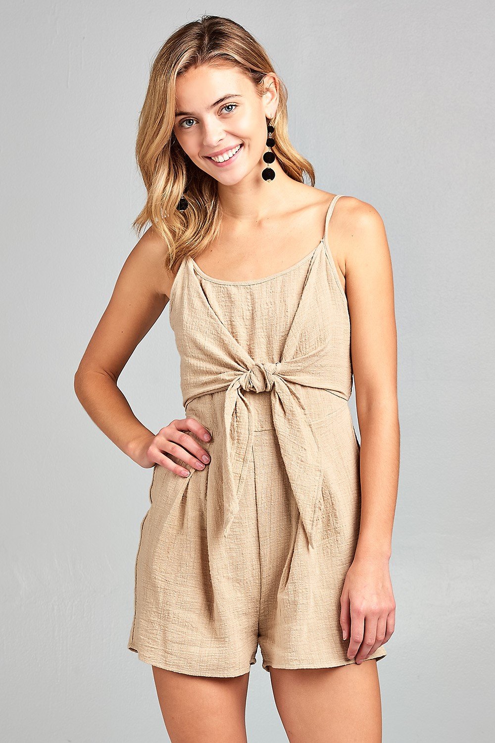 Woman in beige tied romper.