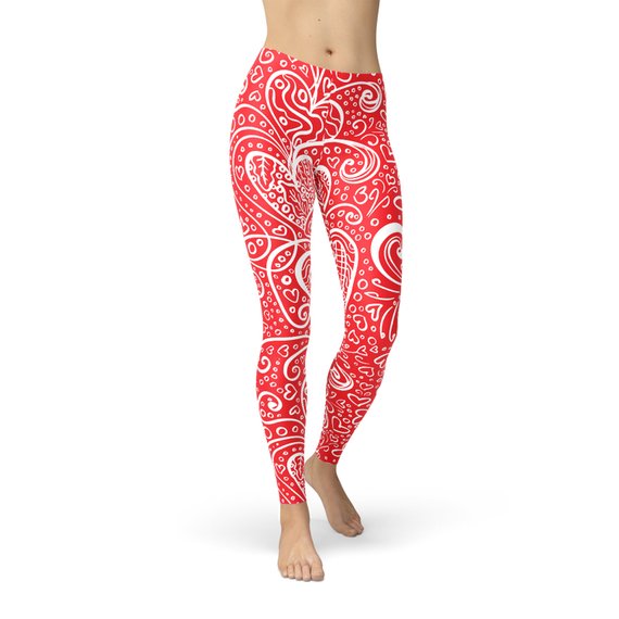 A pair of women's leggings featuring an abstract floral hearts design, showcasing vibrant colors and a stylish pattern, perfect for workouts or casual wear.