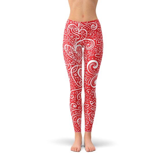 A pair of women's leggings featuring an abstract floral hearts design, showcasing vibrant colors and a stylish pattern, perfect for workouts or casual wear.