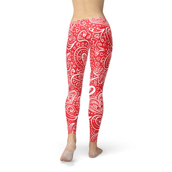 A pair of women's leggings featuring an abstract floral hearts design, showcasing vibrant colors and a stylish pattern, perfect for workouts or casual wear.