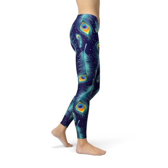 A pair of stylish blue leggings featuring a vibrant peacock feather design, perfect for workouts and casual wear.