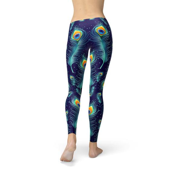 A pair of stylish blue leggings featuring a vibrant peacock feather design, perfect for workouts and casual wear.