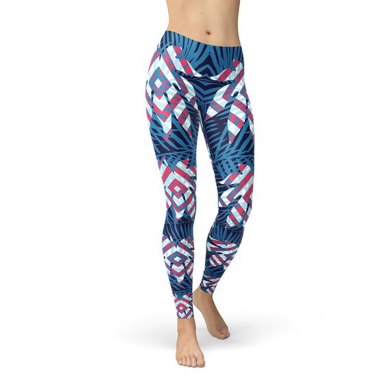 A pair of women's blue tropical leaf leggings featuring a vibrant design, perfect for workouts and casual wear.