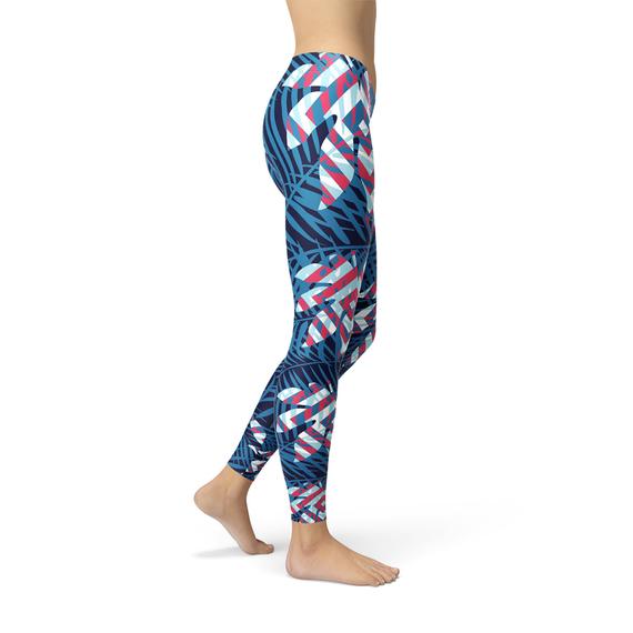 A pair of women's blue tropical leaf leggings featuring a vibrant design, perfect for workouts and casual wear.