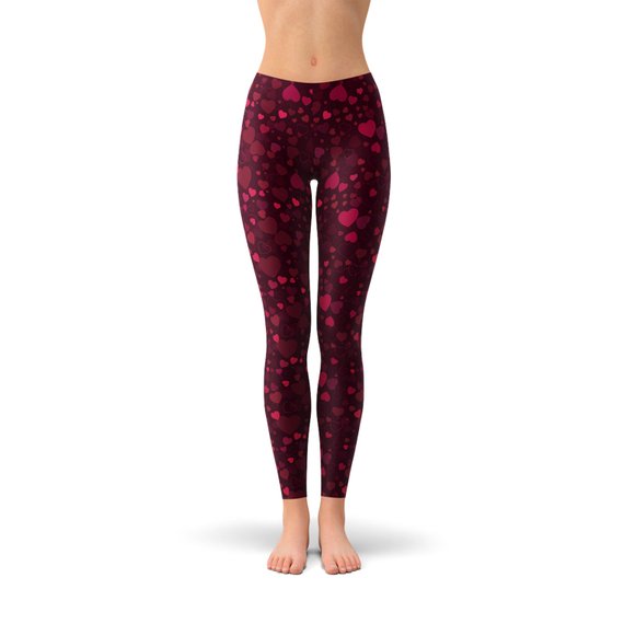 A pair of vibrant red women's leggings featuring a unique hearts design, showcasing their four-way stretch and squat-proof quality, perfect for workouts and casual wear.