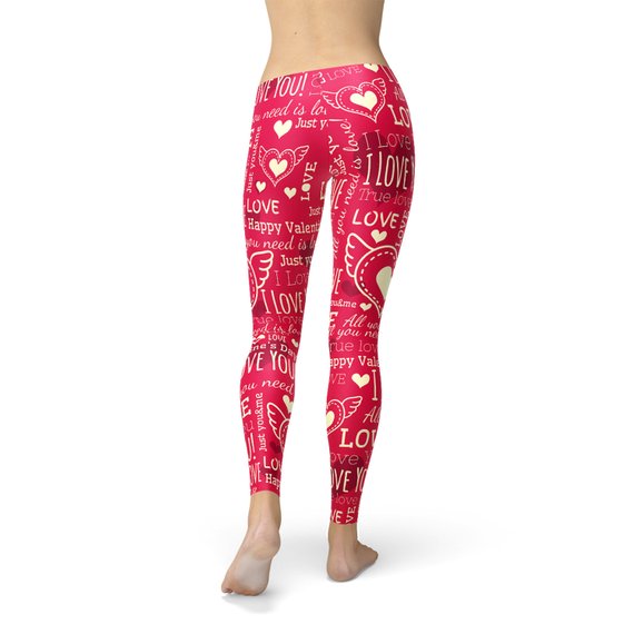 A pair of vibrant red leggings featuring unique heart designs, showcasing their premium quality and stylish look, perfect for workouts and casual wear.