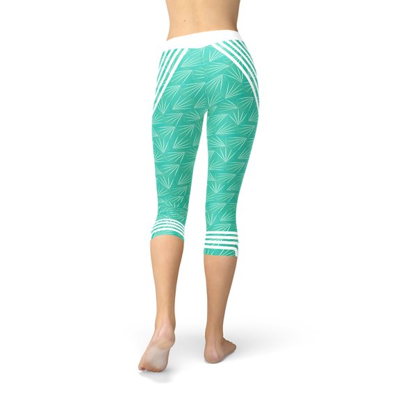 Turquoise Sports Capri Leggings featuring a unique graphic design, perfect for workouts and casual wear.