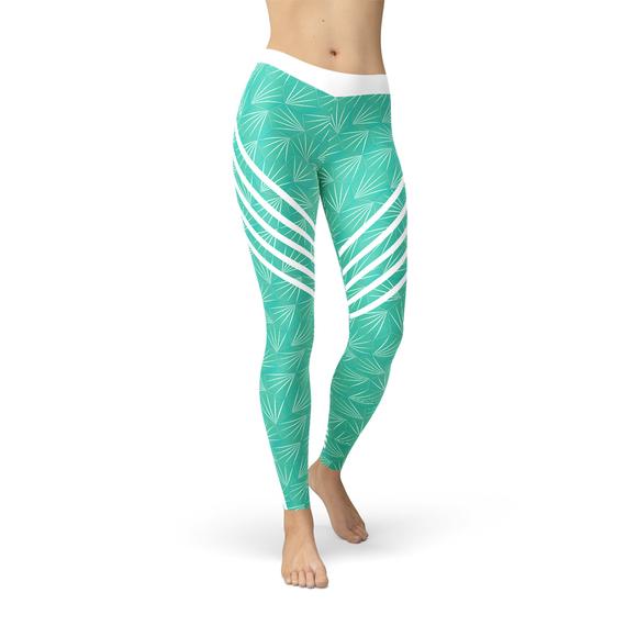 A pair of turquoise sports leggings designed for women, showcasing a unique graphic print and a comfortable fit, ideal for workouts and casual wear.