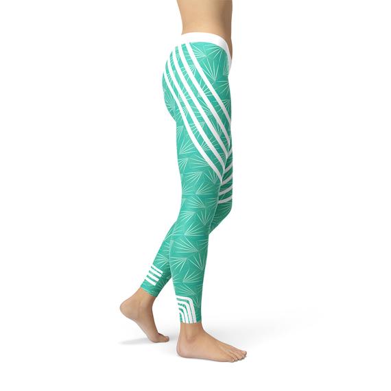 A pair of turquoise sports leggings designed for women, showcasing a unique graphic print and a comfortable fit, ideal for workouts and casual wear.