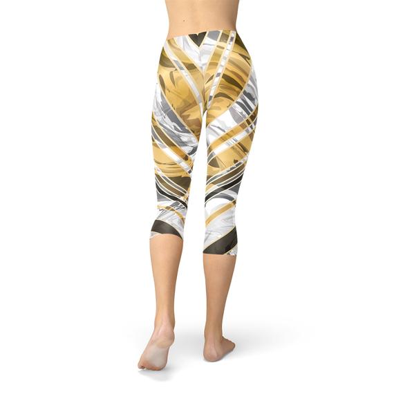 White marble capri leggings with black gold lines, showcasing a stylish and unique design for women's activewear.